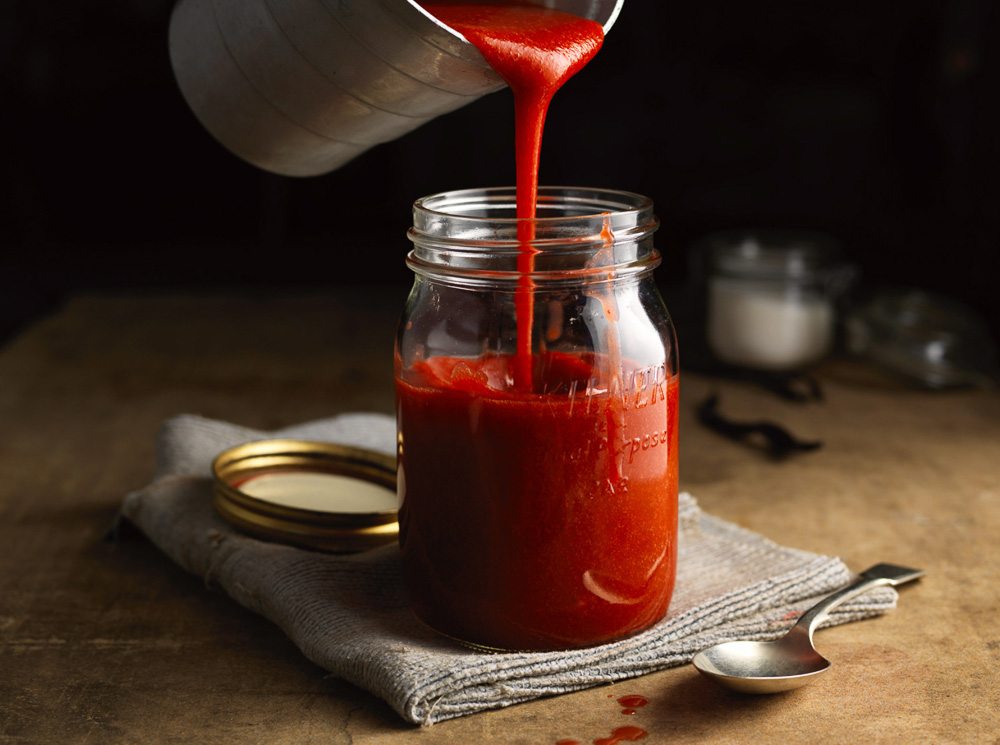 Strawberry coulis pouring copy